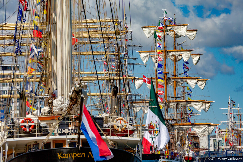 The Falmouth Tall Ships 2023 in August 2023 see ships from across the globe. Dutch and Mexican flags hang from the ships that sail in the sea here